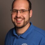 guitare basse, membre du comité, correspondant Voix Romande